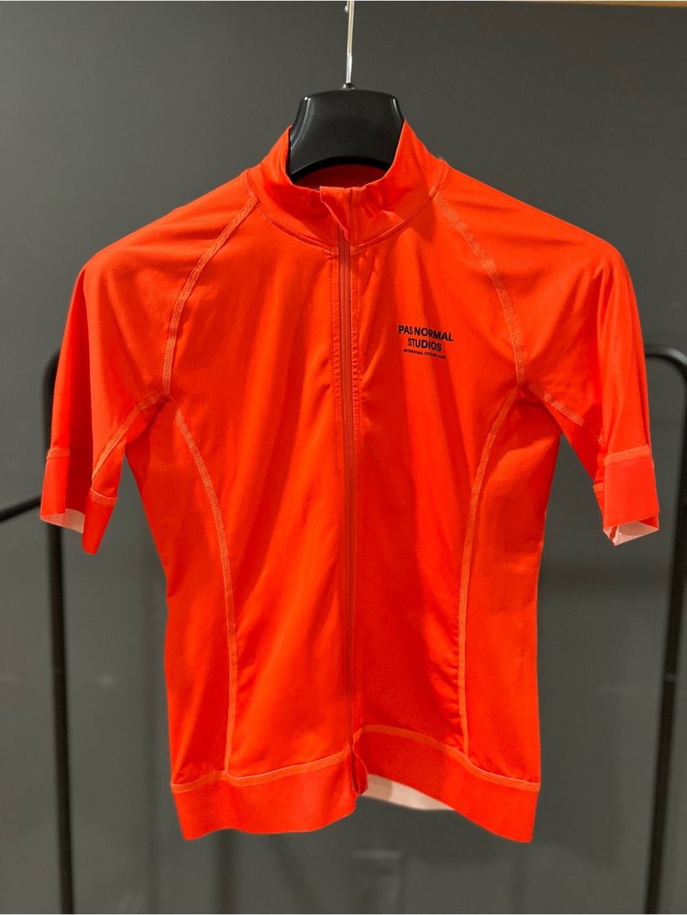 Pas Normal Studios Mechanism Short Sleeve Cycling Jersey in Orange.